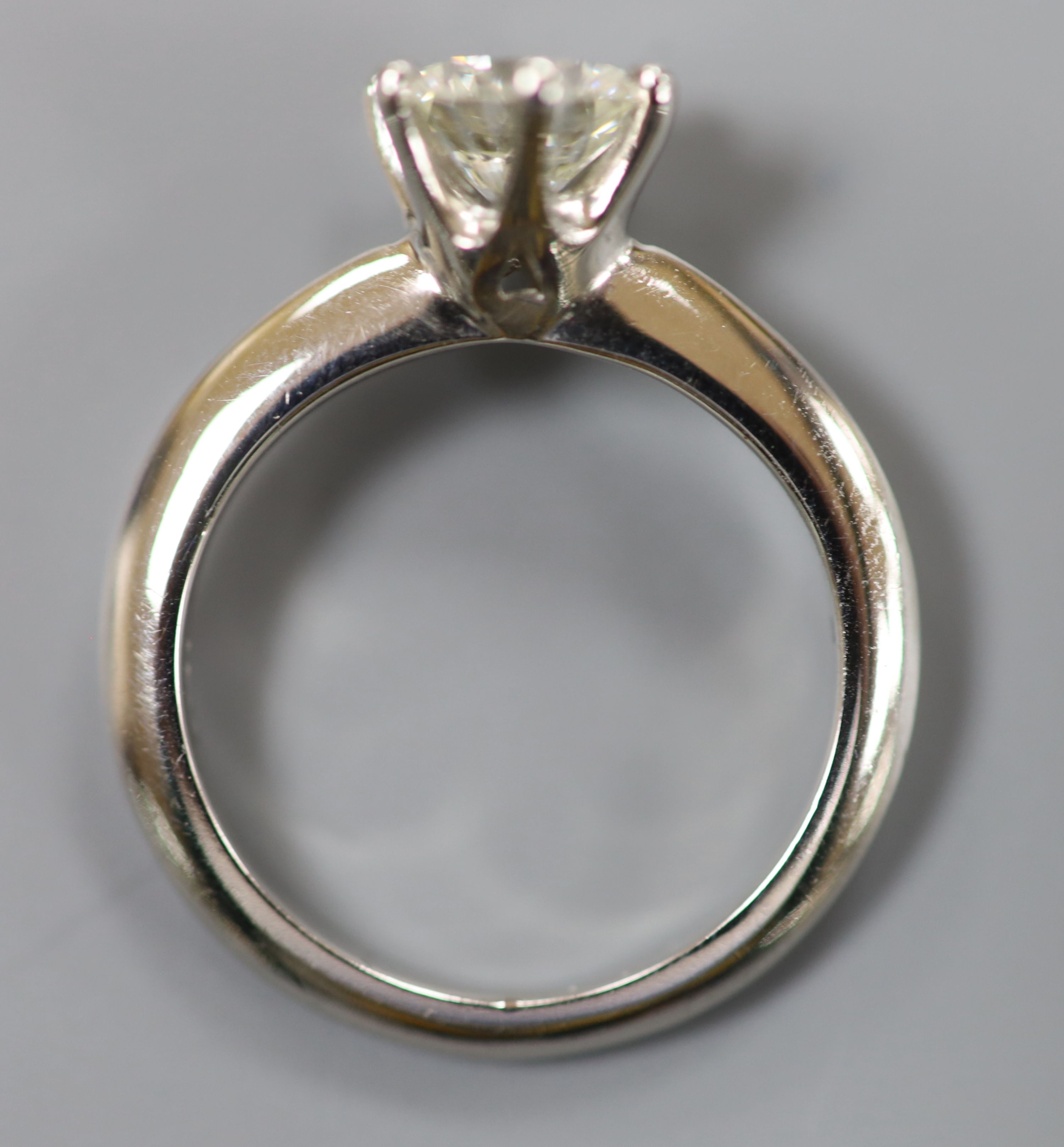 A modern platinum and solitaire diamond ring,